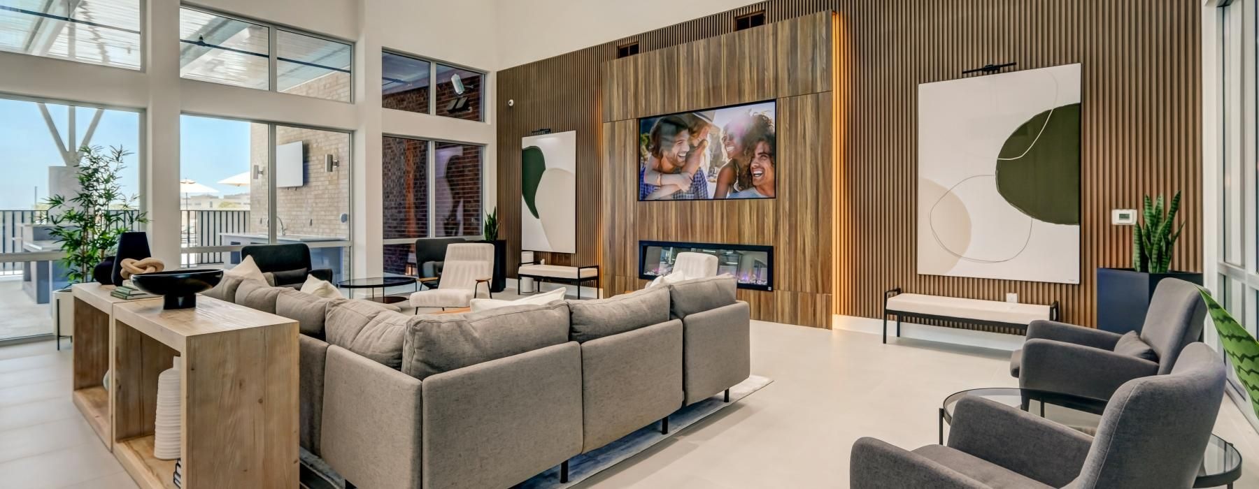 a room with a couch and chairs