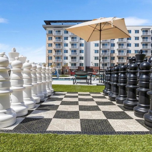 a courtyard with a building in the background