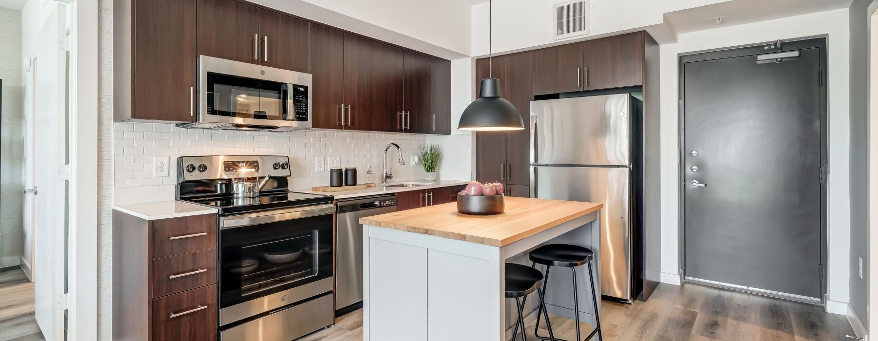 a kitchen with wooden cabinets